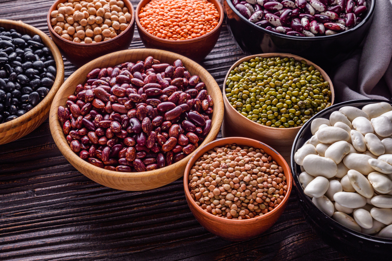 Fresh organic natural beans on wooden rustic background.