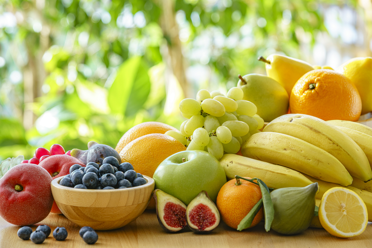 Healthy ripe fruits heap on garden table