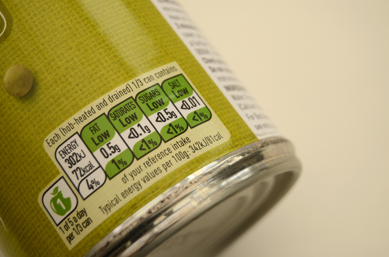 Canned green lentils displaying the contents amount of calories, fat, saturates, sugar and salt